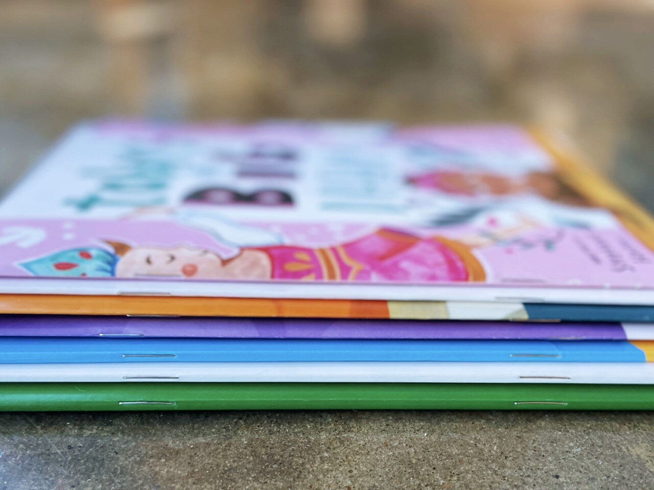 Saddle stitched booklets A stack of booklets with staple saddle stitching